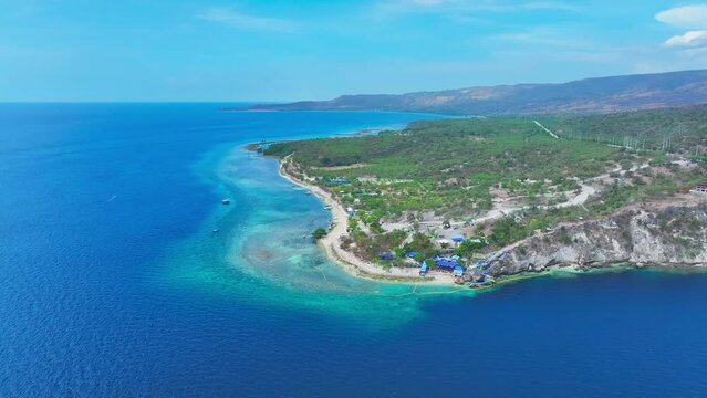 Aerial view of Sarangani Bay with turquoise water and Beach Resort near General Santos City. Sunny day summer day with beautiful landscape of Philippines.