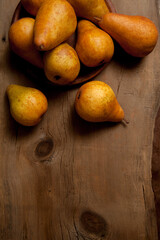 Pears on wooden background as background image..