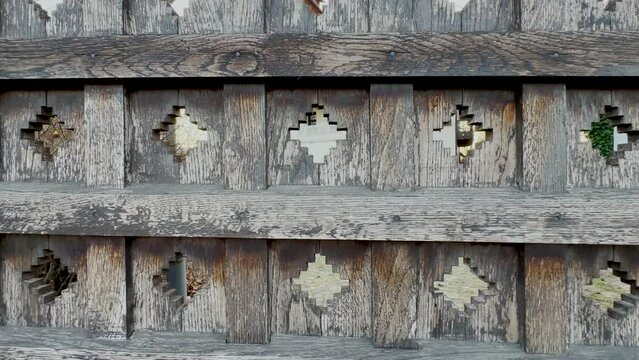 old wooden fence with traditional Romanian motifs. panorama. detail. 4k video.