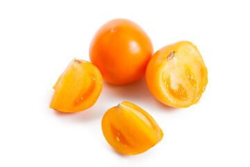 Cut and whole of yellow tomato isolated on white background.