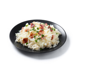 Slovak potato dumplings halusky with steamed sauerkraut and bacon isolated on white background. Copy space
