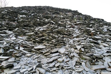 gray stones layer by layer at a pile