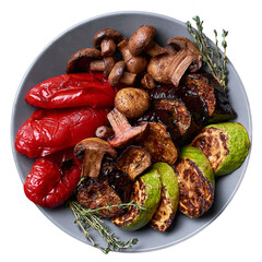 Grilled vegetables with mushrooms on a gray plate. Top view.