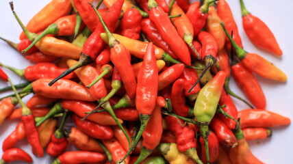 red cayenne pepper in a green bowl. spicy flavored vegetables