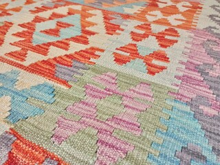 Close up photo of handmade wool Afghanistan Kilim Rug Carpet. Very beautiful textile design and...