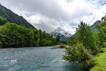 Beautiful landscape of a river with mountains in the background. Psysh River in the Caucasus...