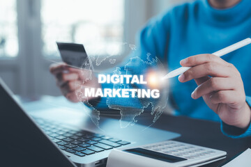 A businessman is using a laptop to create digital marketing content.Creating marketing strategies involves sharing information to attract customer interest.Online marketing and digital marketing.