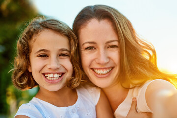 Smile, mother and girl for selfie with portrait in outdoor as family for picture with embrace, bonding and love for memory. Happy, parent and child on vacation for childhood in spring for memory