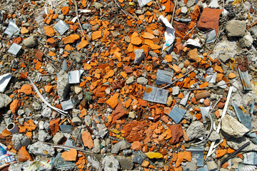 Construction garbage background. Pieces of broken bricks. Abandoned building. Environmental...
