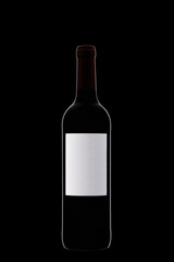 Bottle of wine with a white label with beautiful highlights on a black background