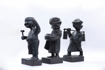 Adorable miniature wooden statue depicting traditional Burmese people, reflecting Myanmar's rich culture and heritage.