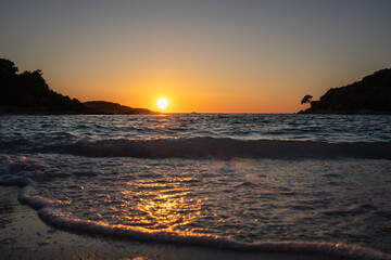 Low Angle View of Ionian Sea Wave during Golden Hour in South Albania. Wavy Water with Sunset in Ksamil.