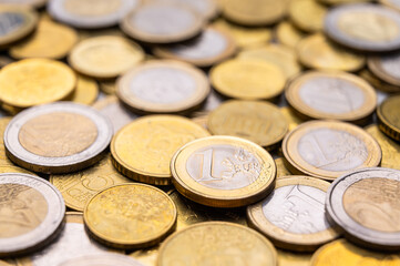 Euro coins close to each other, and 1 euro coin.