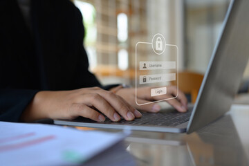 Businesswoman typing the password on laptop to access account on website. Cybersecurity concept