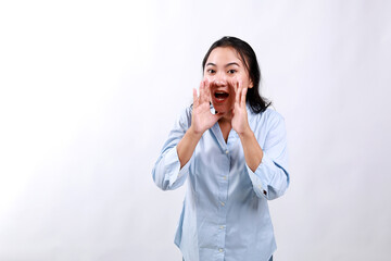 Carefree asian enthusiastic woman shouting long distance, calling friend, breaking free emotions,...