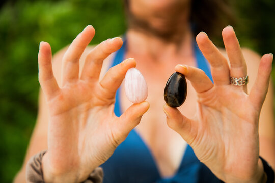 woman holding yoni egg self care tantra