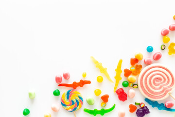 Flat lay of colorful candies and lollipop. Sweet food and candies background