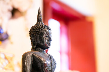 Close-up of Buddha statue in soft focus ,in a Buddhist temple in Thailand of Buddhism