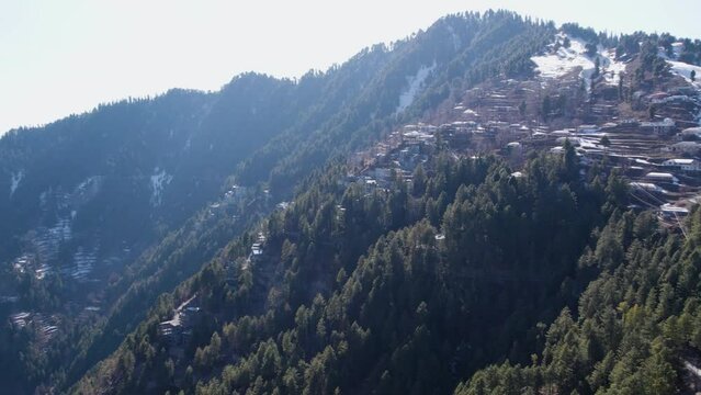 snow-capped hill station surrounded by a dense forest in Ayubia National Park, Nathya Gali, Pakistan
