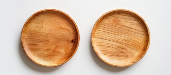 Top and side view of a wooden plate without any contents, placed against a white backdrop.