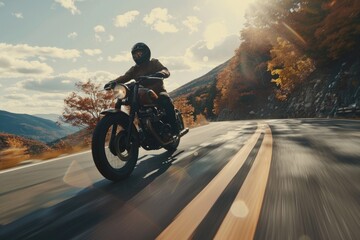 A man riding a motorcycle on a scenic curvy road, perfect for travel and adventure concepts