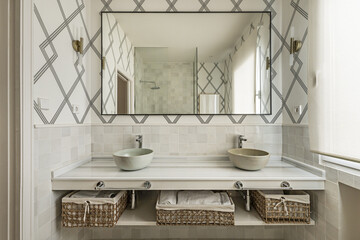 Front image of beautiful bathroom with white marble countertops with individual terracotta sinks...