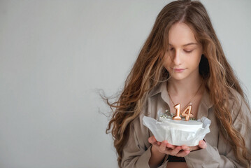 Beautiful girl with long blond hair. Teenager. It's the girl's birthday. The baby is 14 years old....