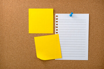 Blank sticky note paper on cork board wall. Noticeboard to organize life and work concept