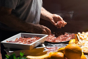 Chef Arranging Charcuterie Board Delicacies