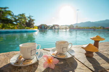 breakfast by the pool, complemented by exquisite wine. Stunning morning vista, creating a perfect setting for relaxation and enjoyment.