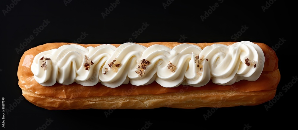 Fototapete A cream filled eclair is seen from above in a photo with ample space for additional elements emphasizing its sweetness and inviting quality