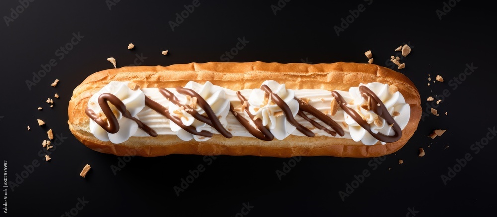 Fototapete a cream filled eclair is seen from above in a photo with ample space for additional elements emphasi