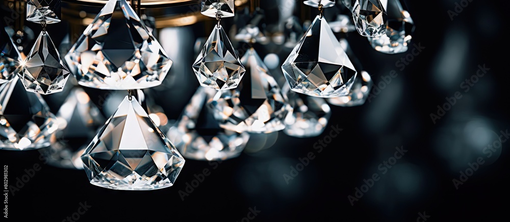 Poster a detailed shot of a modern chandelier s crystal with ample space for copy in the image