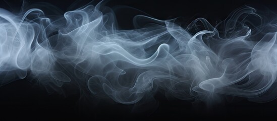 Obraz premium A black background hosts a collection of white smoke in this copy space image