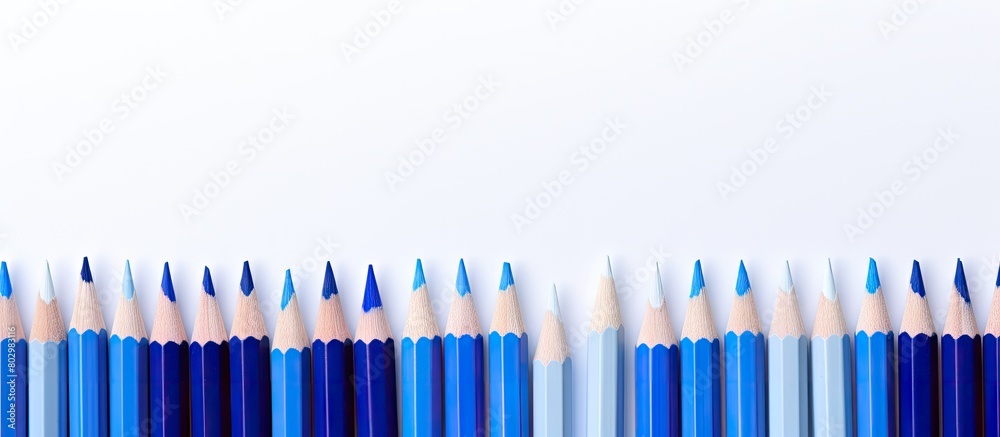Poster a blue pencil can be seen in the middle of a white background in this copy space image