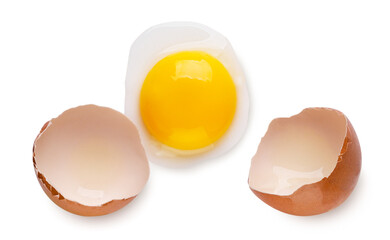 Broken egg, yolk and shell on a white background. Top view