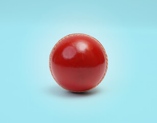 A Shiny New Test Cricket Match Ball Leather Hard Stitched Ball Closeup Photo On Blue Background