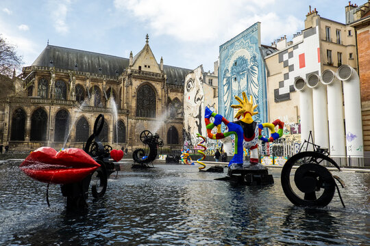 Paris, France - March 11, 2024. Igor-Stravinsky Square with Stravinsky Fountain and Saint-Merri church in the Saint-Merri district of Paris, France. 
