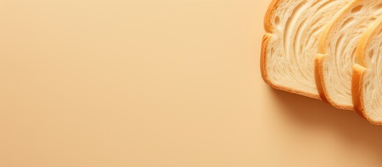A close up top view of a beautiful big sliced bread on a cream color background perfect for design with copy space image - Powered by Adobe