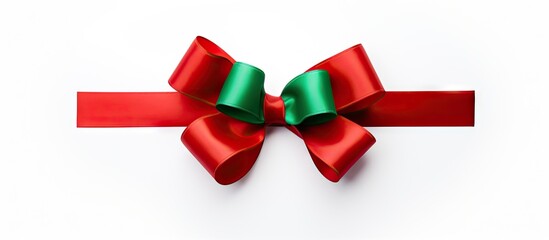 A colorful gift bow in red and green set against a clean white background providing ample copy space for your image