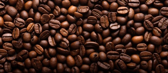 Fototapeta premium A background image featuring the texture of coffee beans for use with copy space