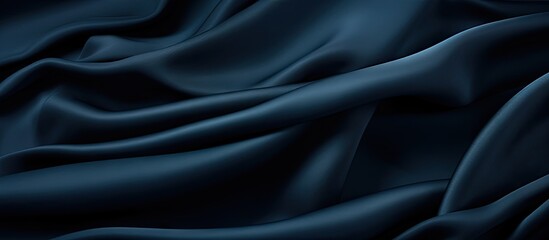 Obraz premium A close up of a dark blue fabric texture with no visible objects providing copy space for an image