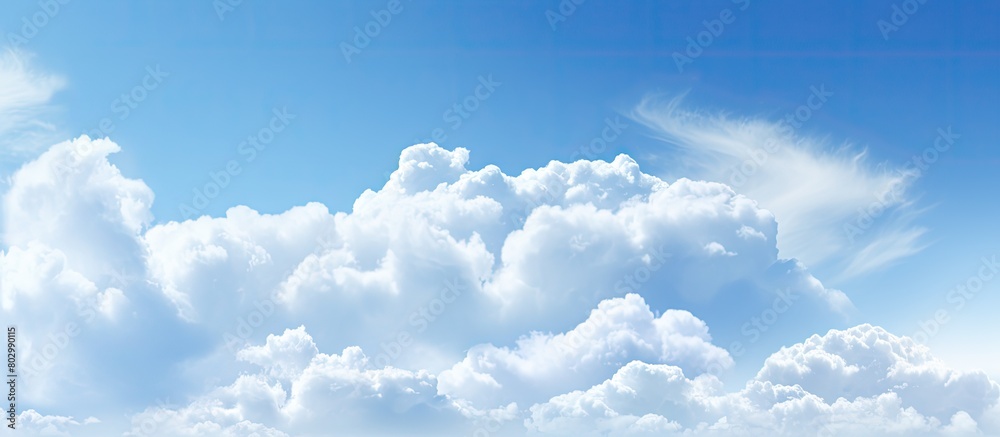 Poster a copy space image featuring clouds against a backdrop of a blue sky