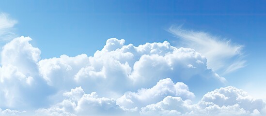 A copy space image featuring clouds against a backdrop of a blue sky