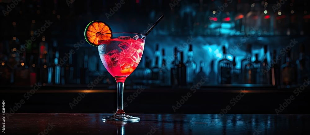Poster a cocktail at the bar in a night club with a black background is captured in the copy space image