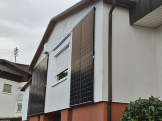 a house in the countryside with a solar panel