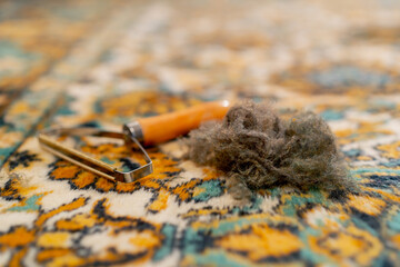 close up professional cleaning of the apartment there is a wool scraper and a wool spool on the...