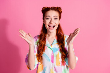 Photo of ecstatic impressed girl with redhair tails dressed colorful blouse clap her hands staring...