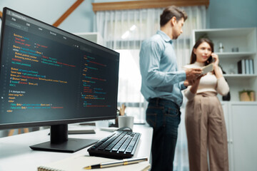 Coding software screens newest creative website on working desk against on woman developer making...