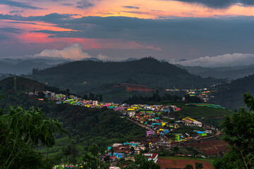 Nilgiris beauty of Ooty tea estates, where emerald-green fields meet the rolling clouds, creating a...